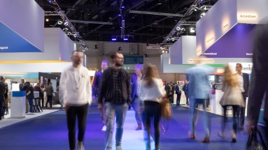 Visitors at the Smart Country Convention 2022, on the right and left exhibition stands.