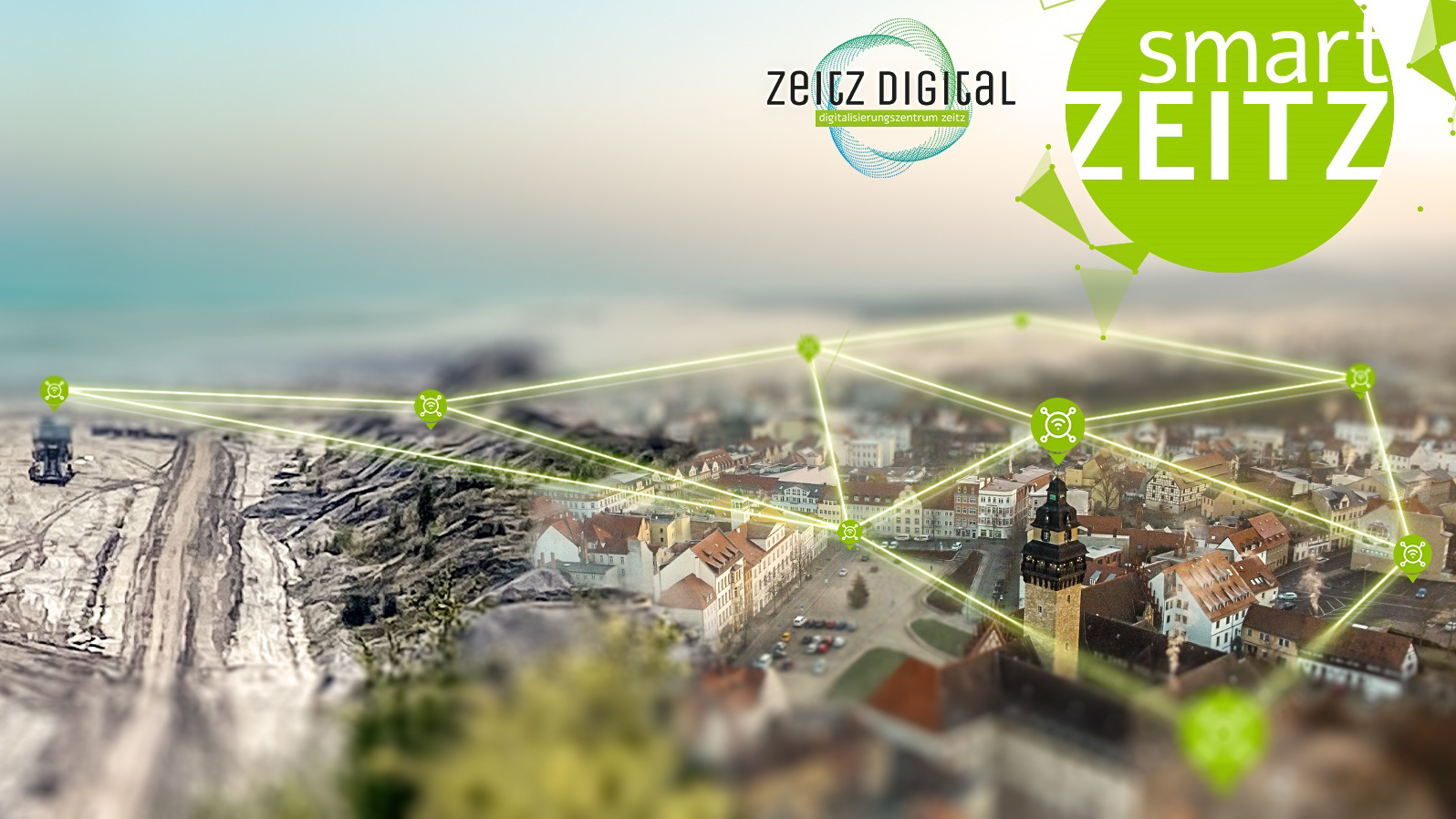 Aerial view of the city of Zeitz and the neighbouring coalfield, a digital network is depicted with the help of green lines.